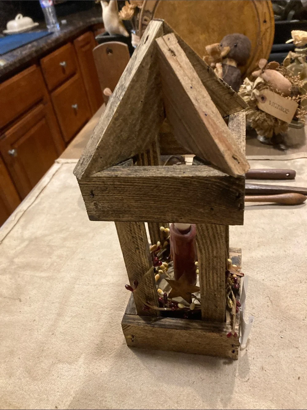 Rustic Wooden Lantern with Red Candle Accent